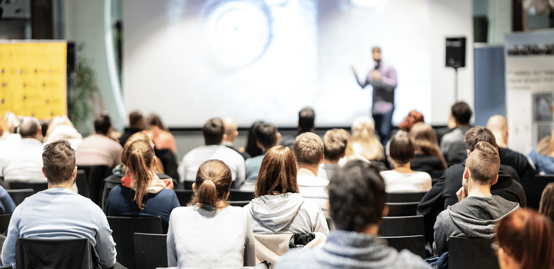 A Person Standing In Front Of A Screen